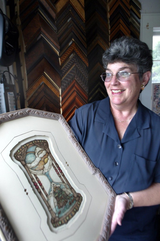 Bonnie Lyttle with a custom cut mat shaped to the artwork.